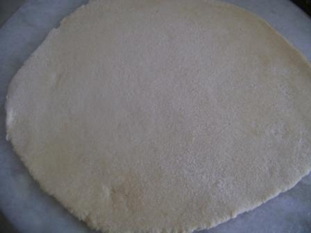Roll it into a flat bread in a round shape